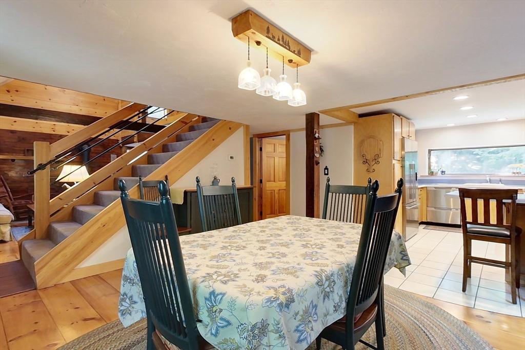 249 Pillsbury Road Ashby, MA 01431 - Photo 8 of 39 a view of a dining room with furniture and wooden floor