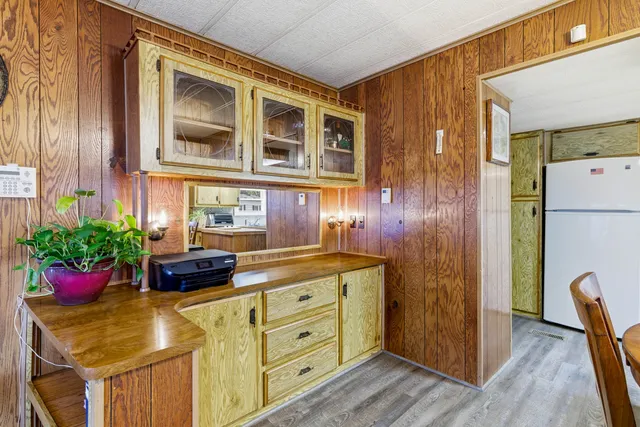 a kitchen with a refrigerator and stove