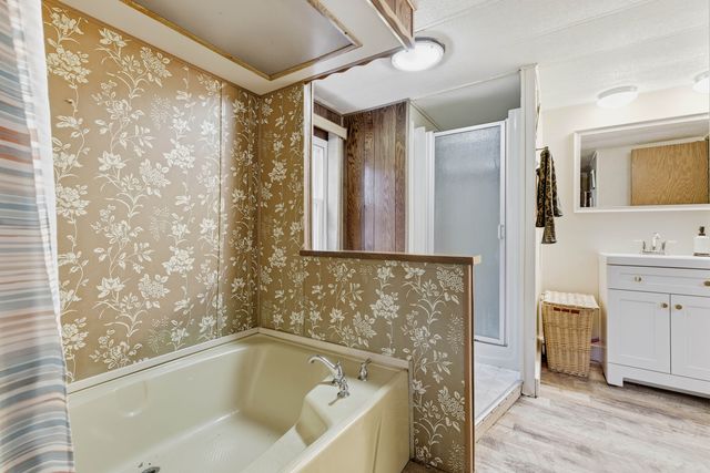 a bathroom with a bathtub and a sink