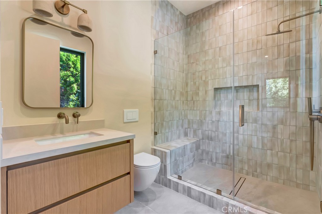 5149 Beeman Avenue Valley Village, CA 91607 - Photo 14 of 21 a bathroom with a sink a toilet and shower