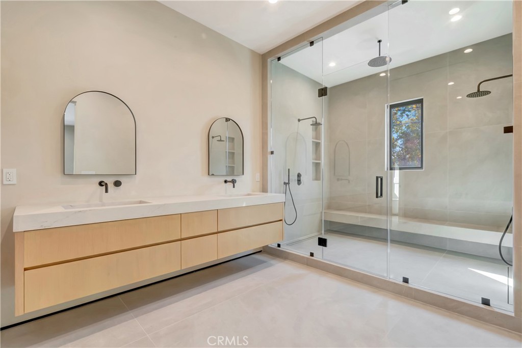 5149 Beeman Avenue Valley Village, CA 91607 - Photo 17 of 21 a bathroom with a double vanity sink mirror and bathtub