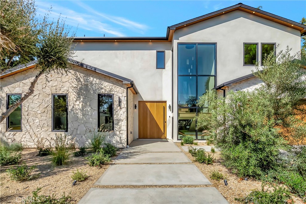 5149 Beeman Avenue Valley Village, CA 91607 - Photo 2 of 21 a front view of a house with a yard