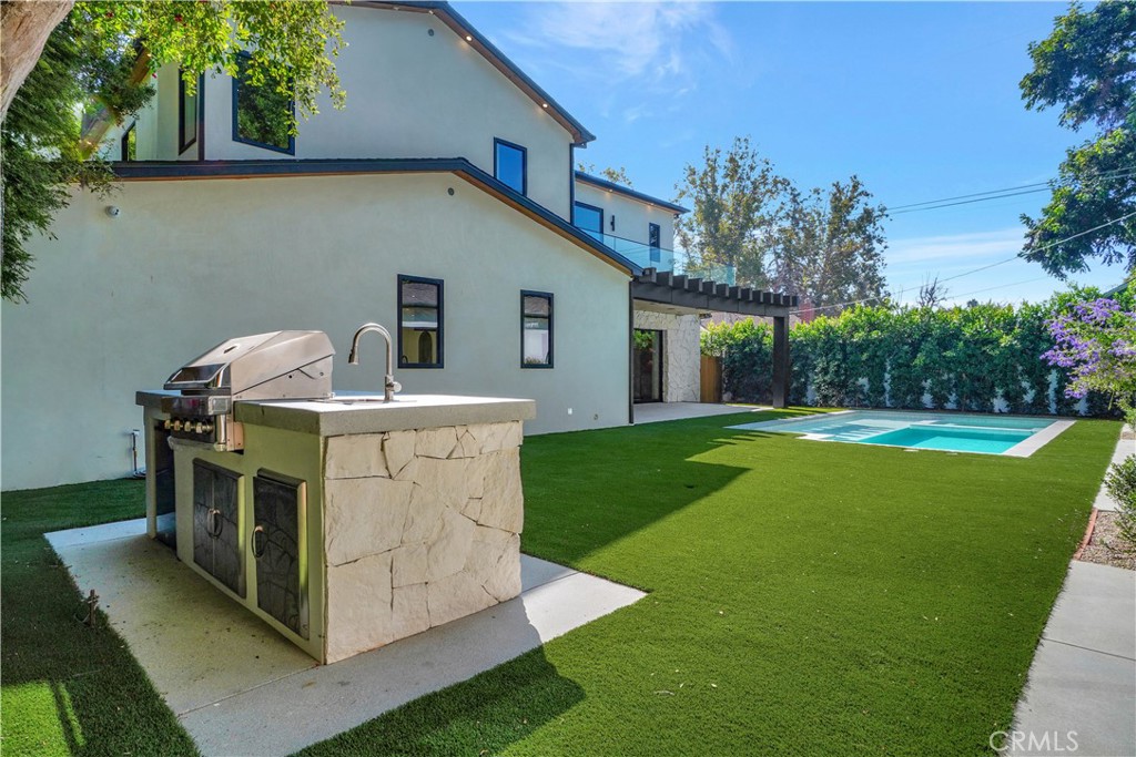 5149 Beeman Avenue Valley Village, CA 91607 - Photo 21 of 21 a view of a house with a sink and garden
