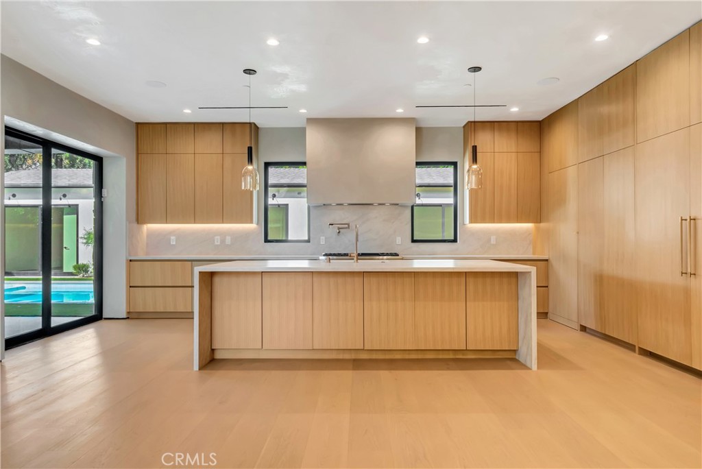 5149 Beeman Avenue Valley Village, CA 91607 - Photo 9 of 21 a view of kitchen with stainless steel appliances granite countertop a sink and a refrigerator