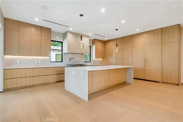 a kitchen with stainless steel appliances granite countertop a stove and a sink