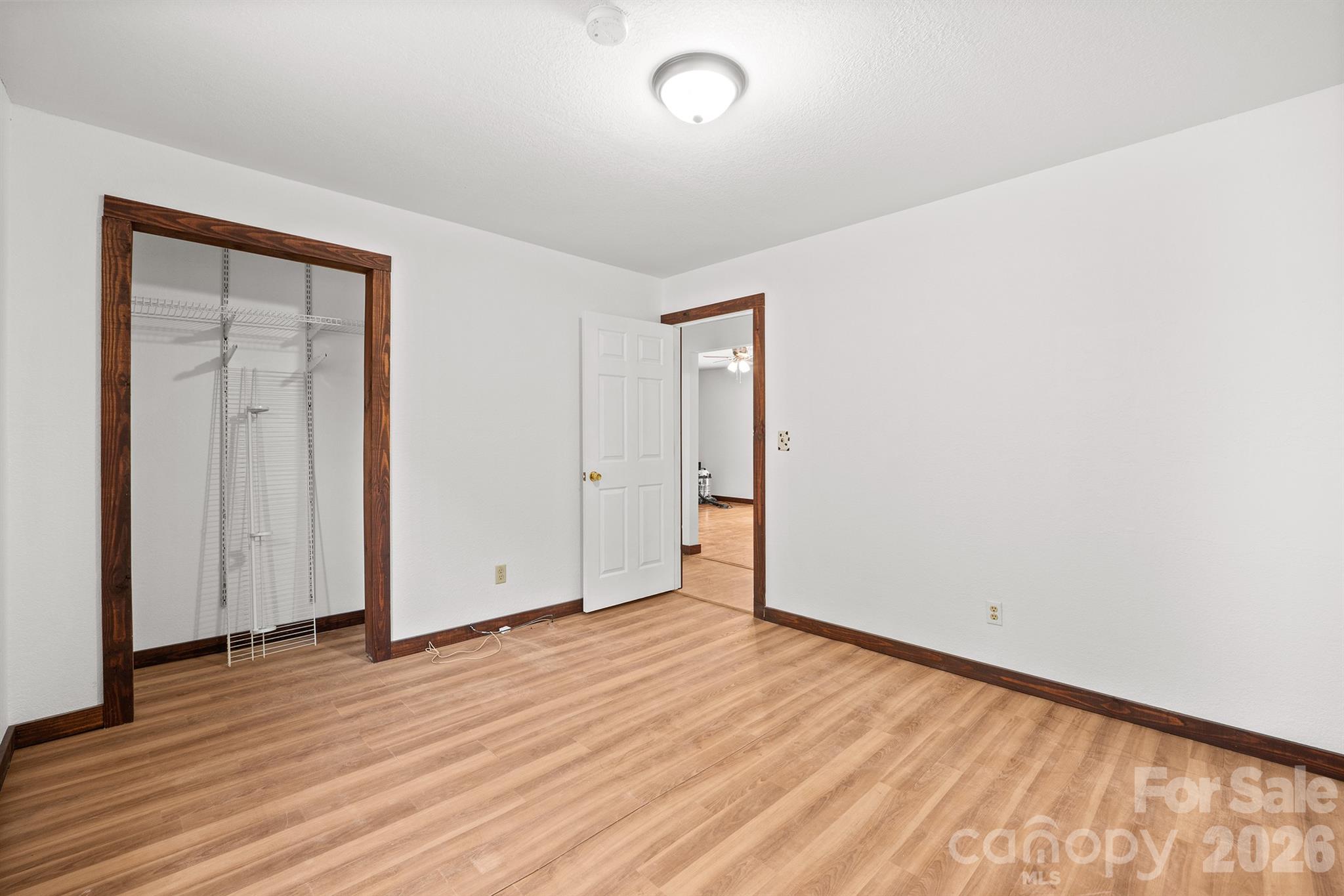 7400 Corn Hill Road Connelly Springs, NC 28612 - Photo 25 of 41 an empty room with wooden floor and windows