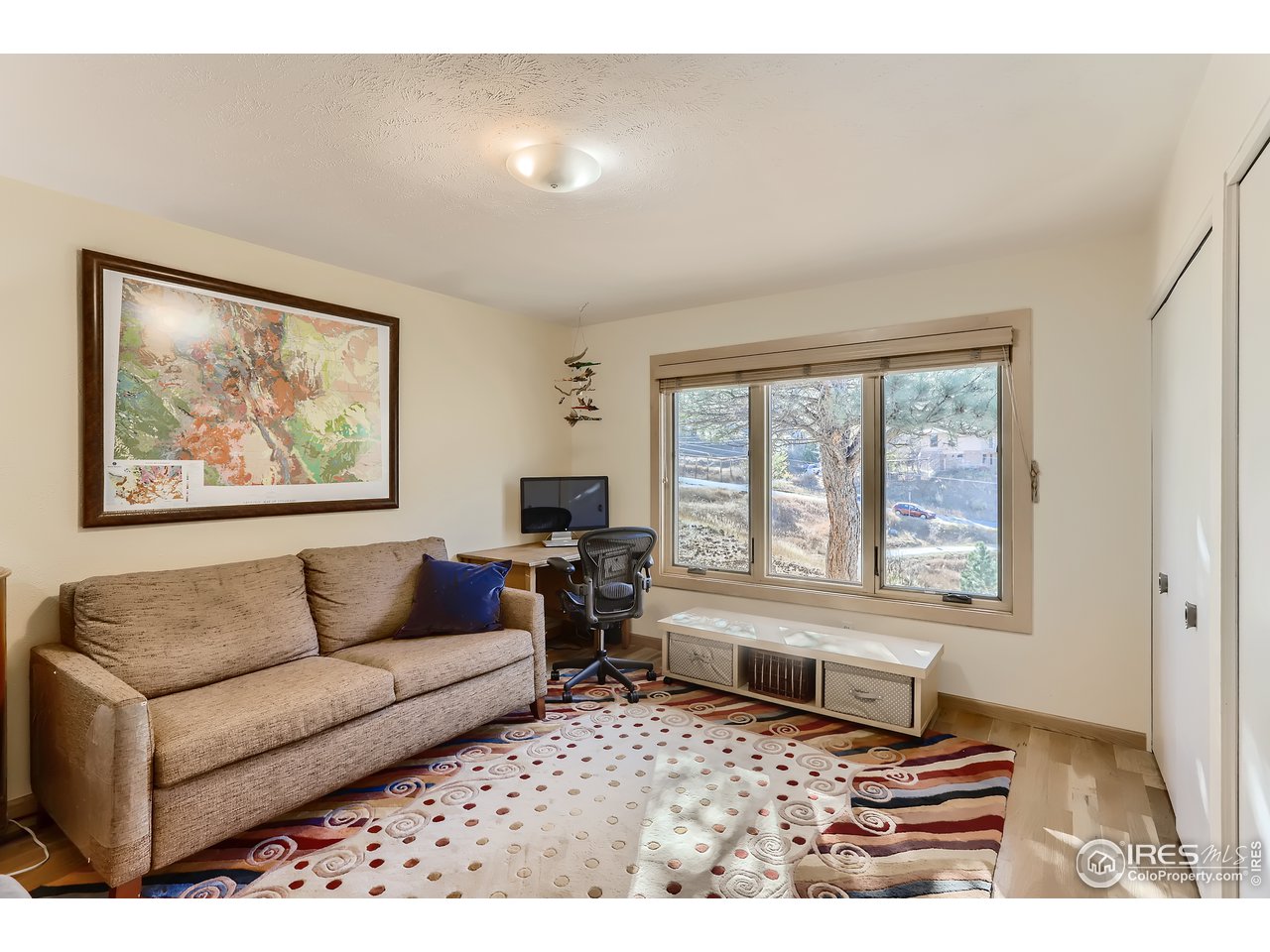 389 South Cedar Brook Road Boulder, CO 80304 - Photo 13 of 30 a living room with furniture and a window