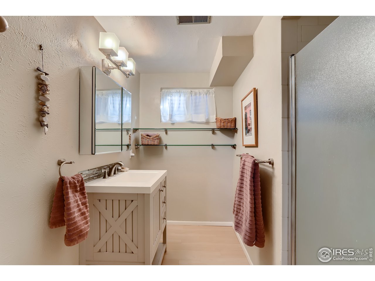 389 South Cedar Brook Road Boulder, CO 80304 - Photo 18 of 30 a bathroom with a sink a mirror and a vanity