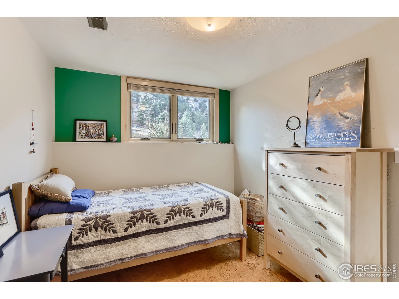 389 South Cedar Brook Road Boulder, CO 80304 - Photo 19 of 30 a bedroom with a bed and window