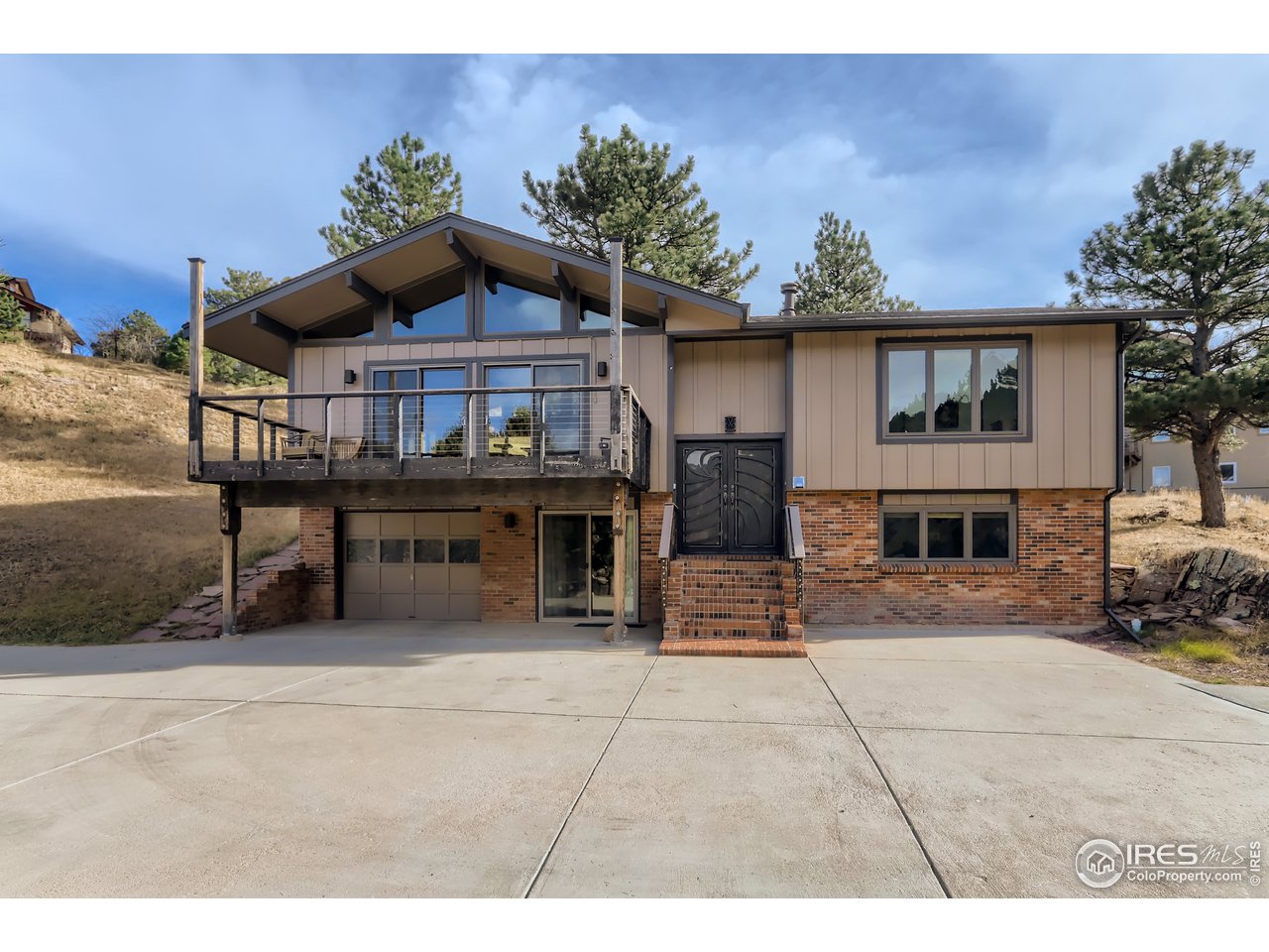 389 South Cedar Brook Road Boulder, CO 80304 - Photo 2 of 30 a view of a house with a bench in patio