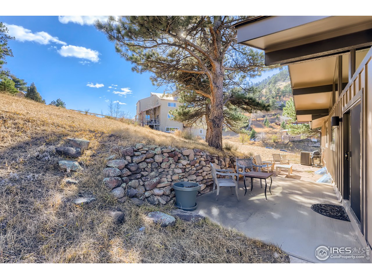 389 South Cedar Brook Road Boulder, CO 80304 - Photo 24 of 30 a view of a backyard with table and chairs