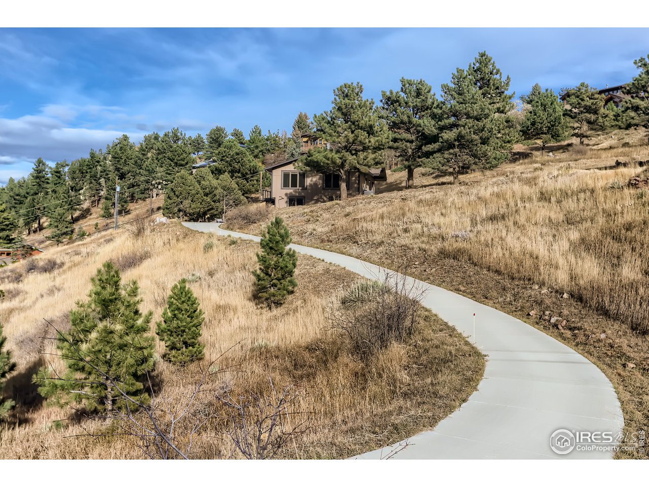 389 South Cedar Brook Road Boulder, CO 80304 - Photo 4 of 30 a view of a yard with wooden fence