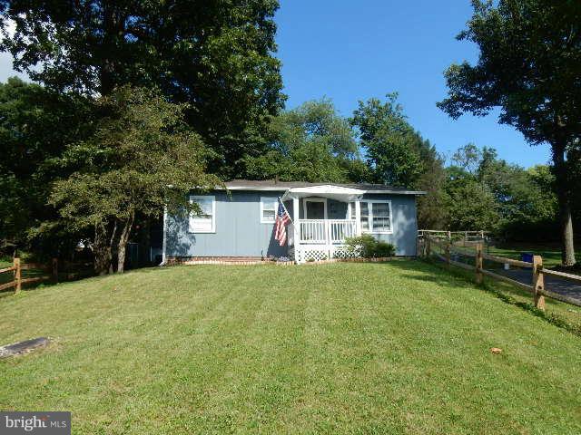 403 Buffalo Road Mount Airy, MD 21771 - Photo 1 of 14 a front view of house with yard and trees