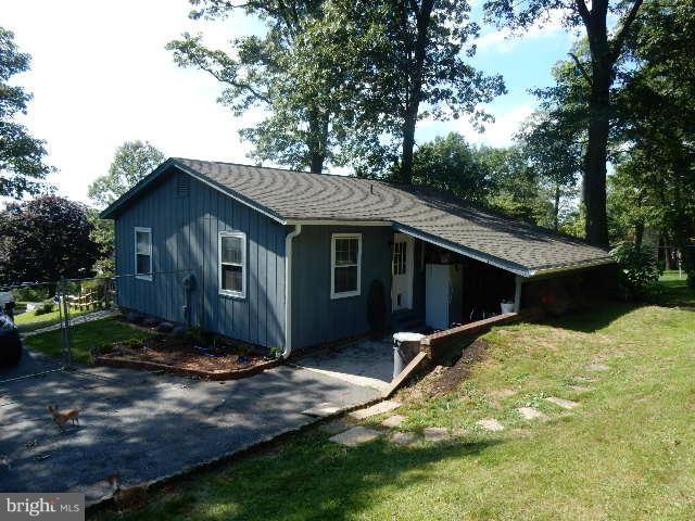 403 Buffalo Road Mount Airy, MD 21771 - Photo 3 of 14 a house with trees in the background