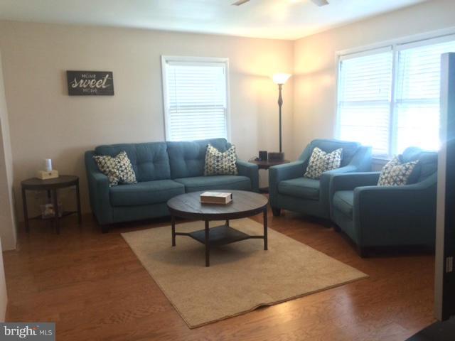 403 Buffalo Road Mount Airy, MD 21771 - Photo 7 of 14 a living room with furniture and a large window