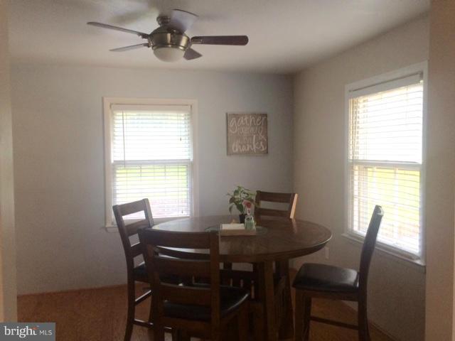 403 Buffalo Road Mount Airy, MD 21771 - Photo 8 of 14 a view of a dining room with a table and chairs