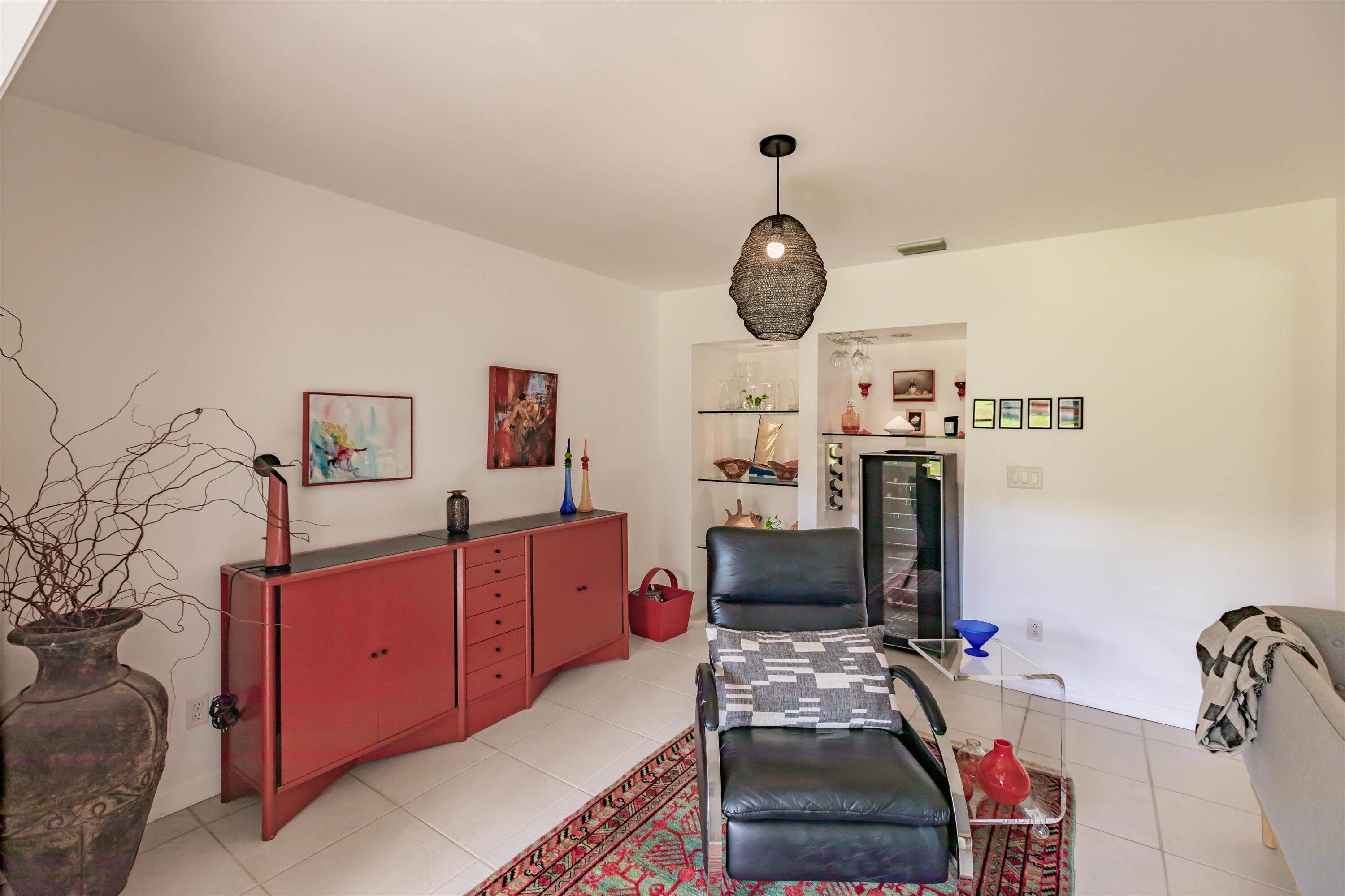 6115 Southeast Georgetown Place, Unit 1006 Hobe Sound, FL 33455 - Photo 14 of 68 a bedroom with a bed and a television