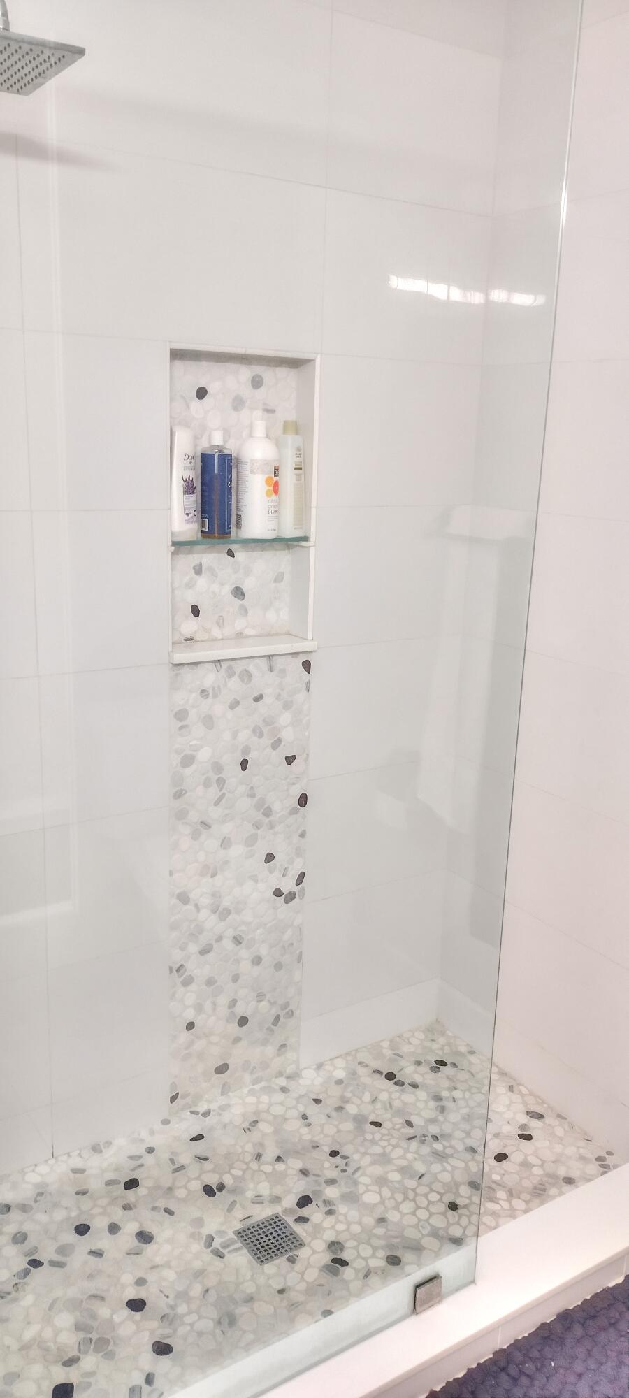 6115 Southeast Georgetown Place, Unit 1006 Hobe Sound, FL 33455 - Photo 22 of 68 a bathroom with a shower