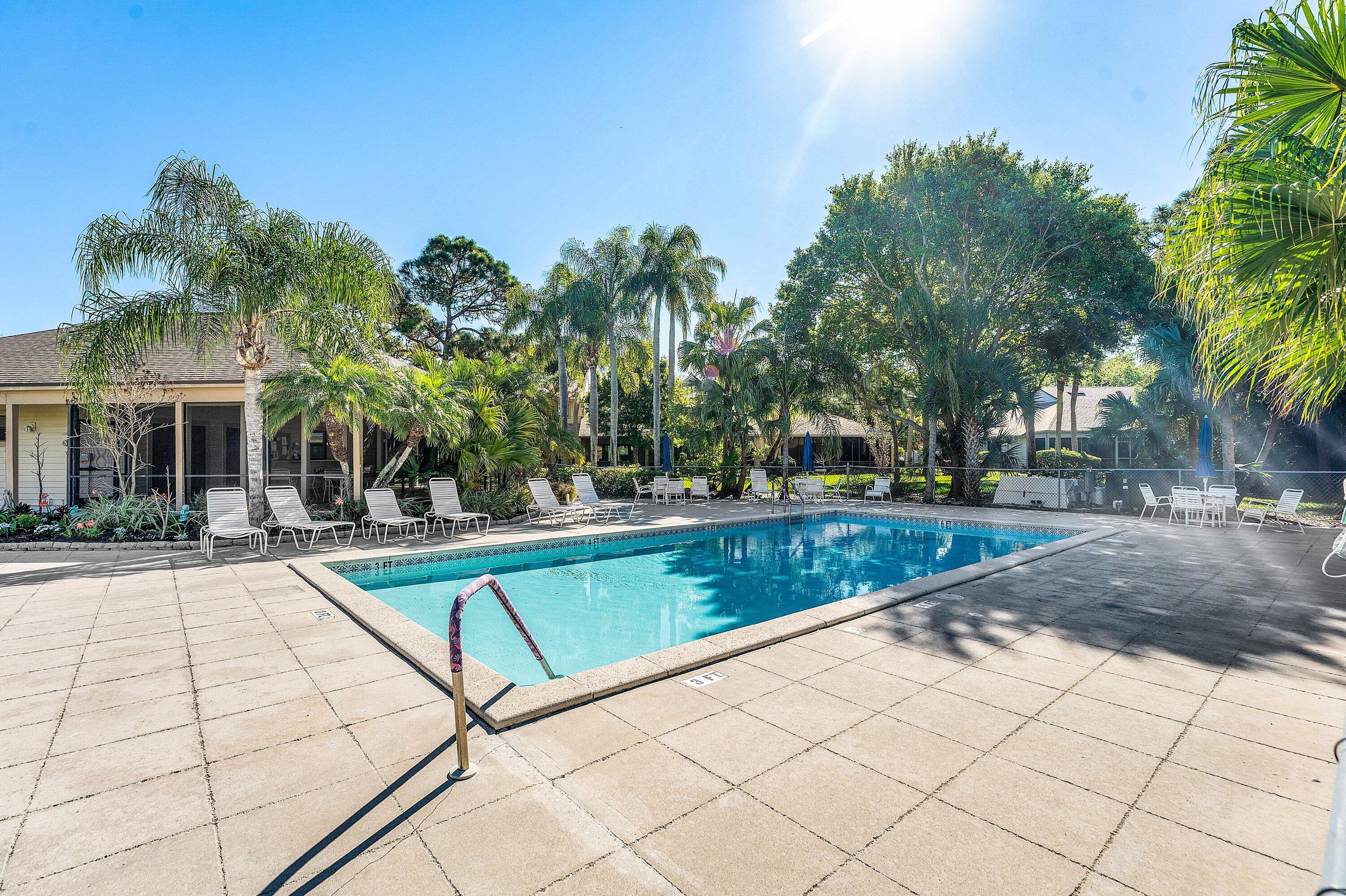 6115 Southeast Georgetown Place, Unit 1006 Hobe Sound, FL 33455 - Photo 67 of 68 a view of house with outdoor space and swimming pool