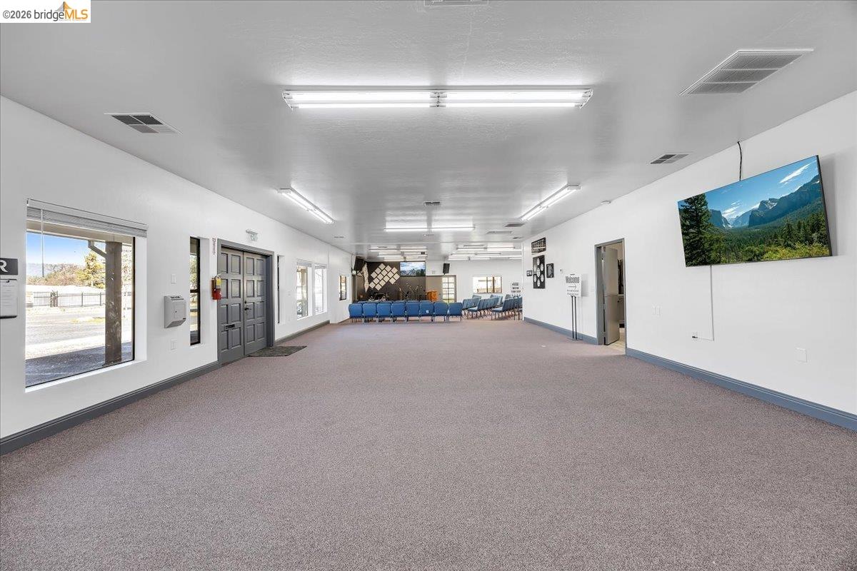 14326 Tuolumne Road Sonora, CA 95370 - Photo 18 of 48 a living room with furniture and a flat screen tv