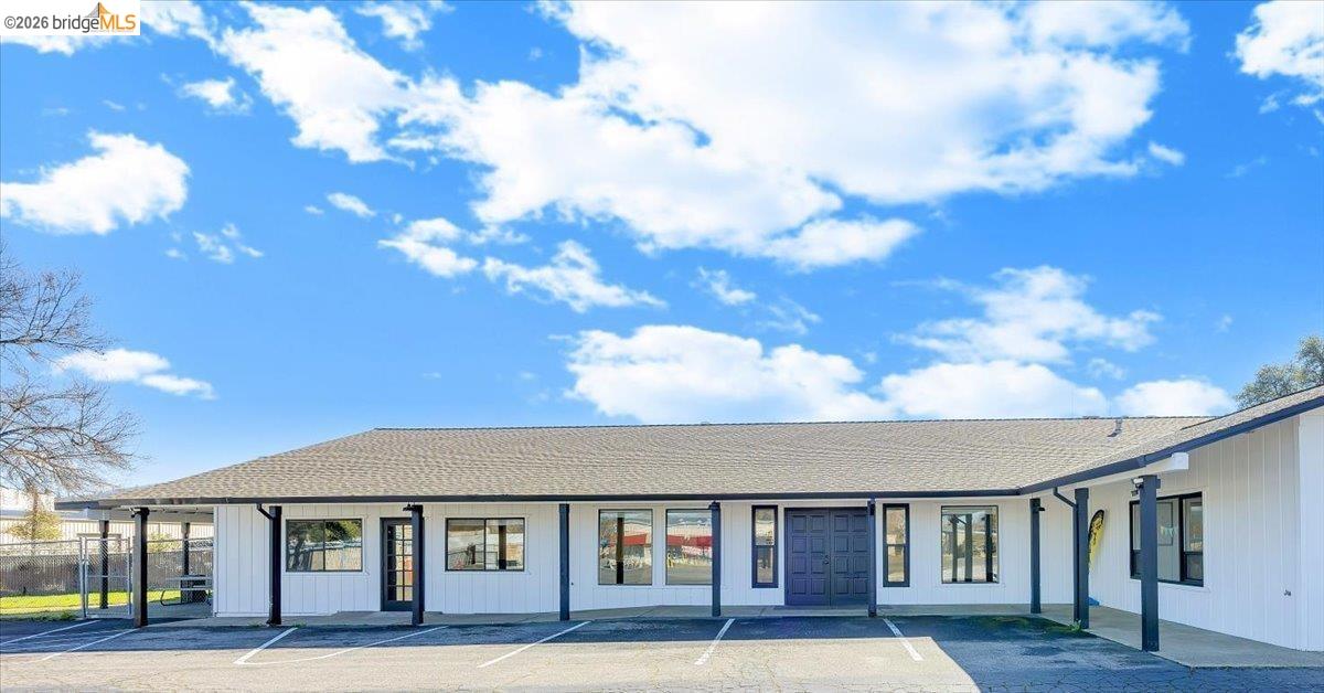 14326 Tuolumne Road Sonora, CA 95370 - Photo 2 of 48 a front view of a house with a garden