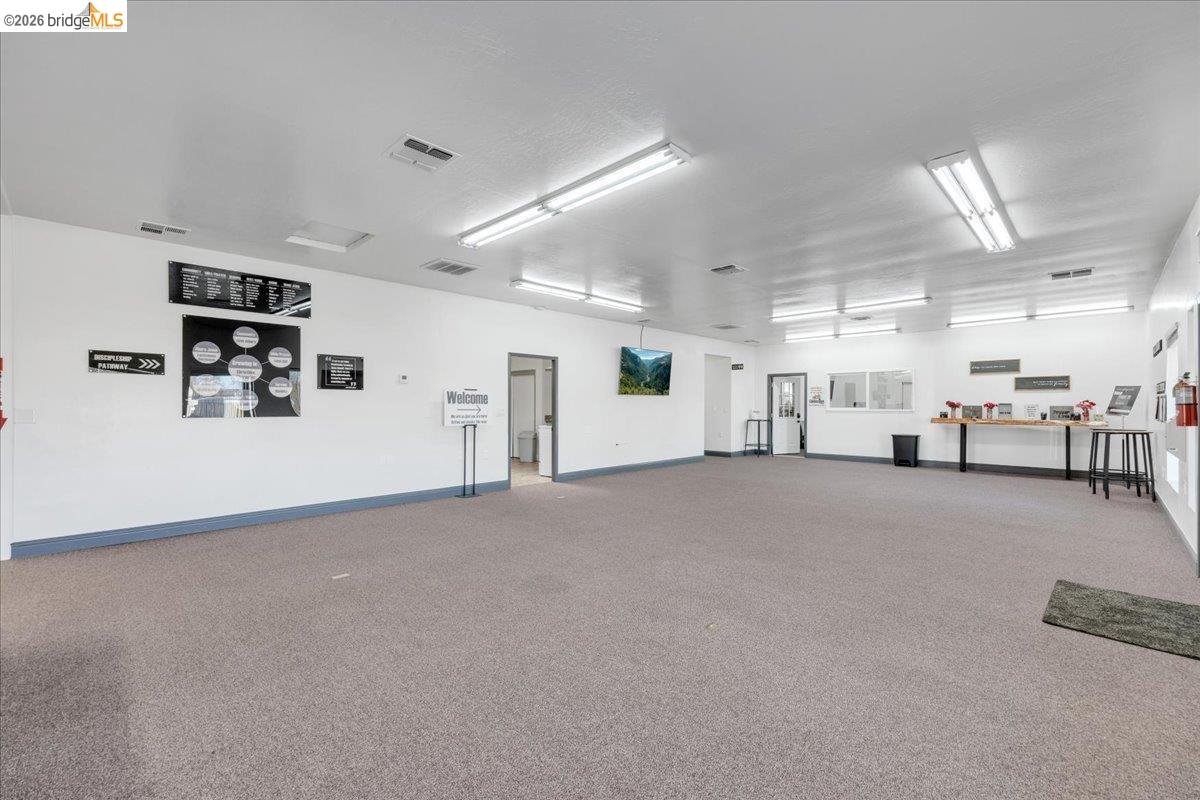 14326 Tuolumne Road Sonora, CA 95370 - Photo 21 of 48 a view of a livingroom with furniture and a flat screen tv