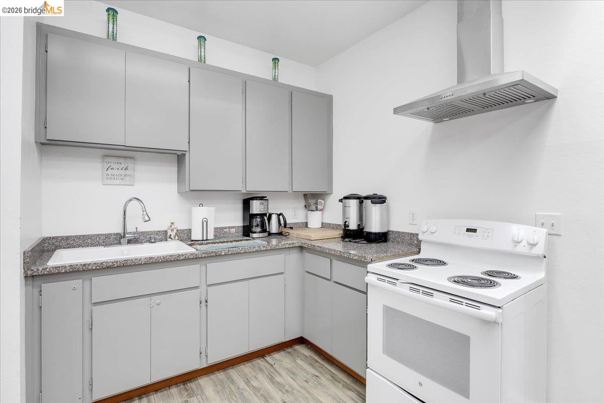 14326 Tuolumne Road Sonora, CA 95370 - Photo 27 of 48 a kitchen with stainless steel appliances granite countertop a sink stove and refrigerator