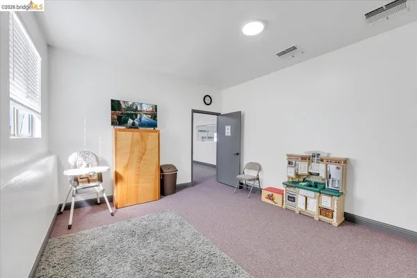 a workspace with furniture and a window