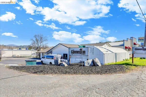 an aerial view of a yard with outdoor seating