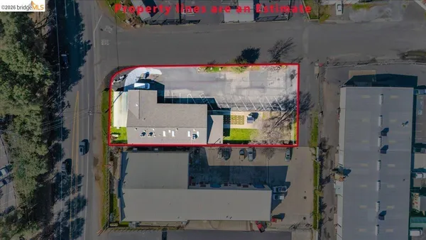 an aerial view of a house with a swimming pool