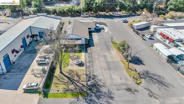 an aerial view of a house with a swimming pool