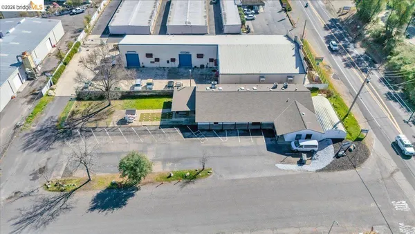 an aerial view of a house with outdoor space