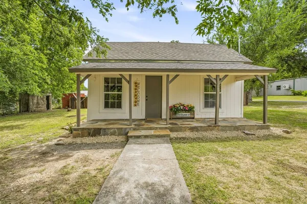 front view of a house with a yard