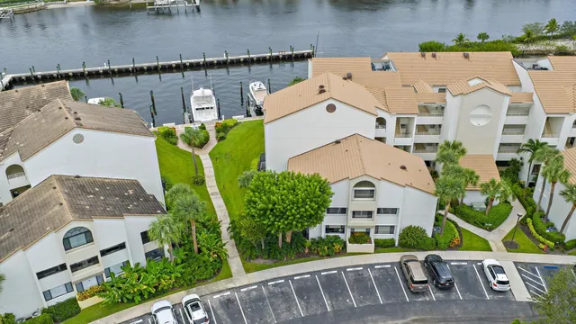 an aerial view of a house with swimming pool and garden