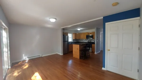 a kitchen with granite countertop a stove and a refrigerator