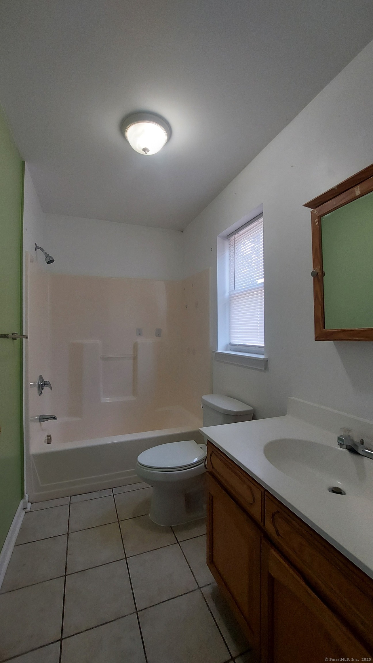 10 Hillcrest Street, Unit B Norwich, CT 06360 - Photo 18 of 34 a bathroom with a sink a toilet and shower