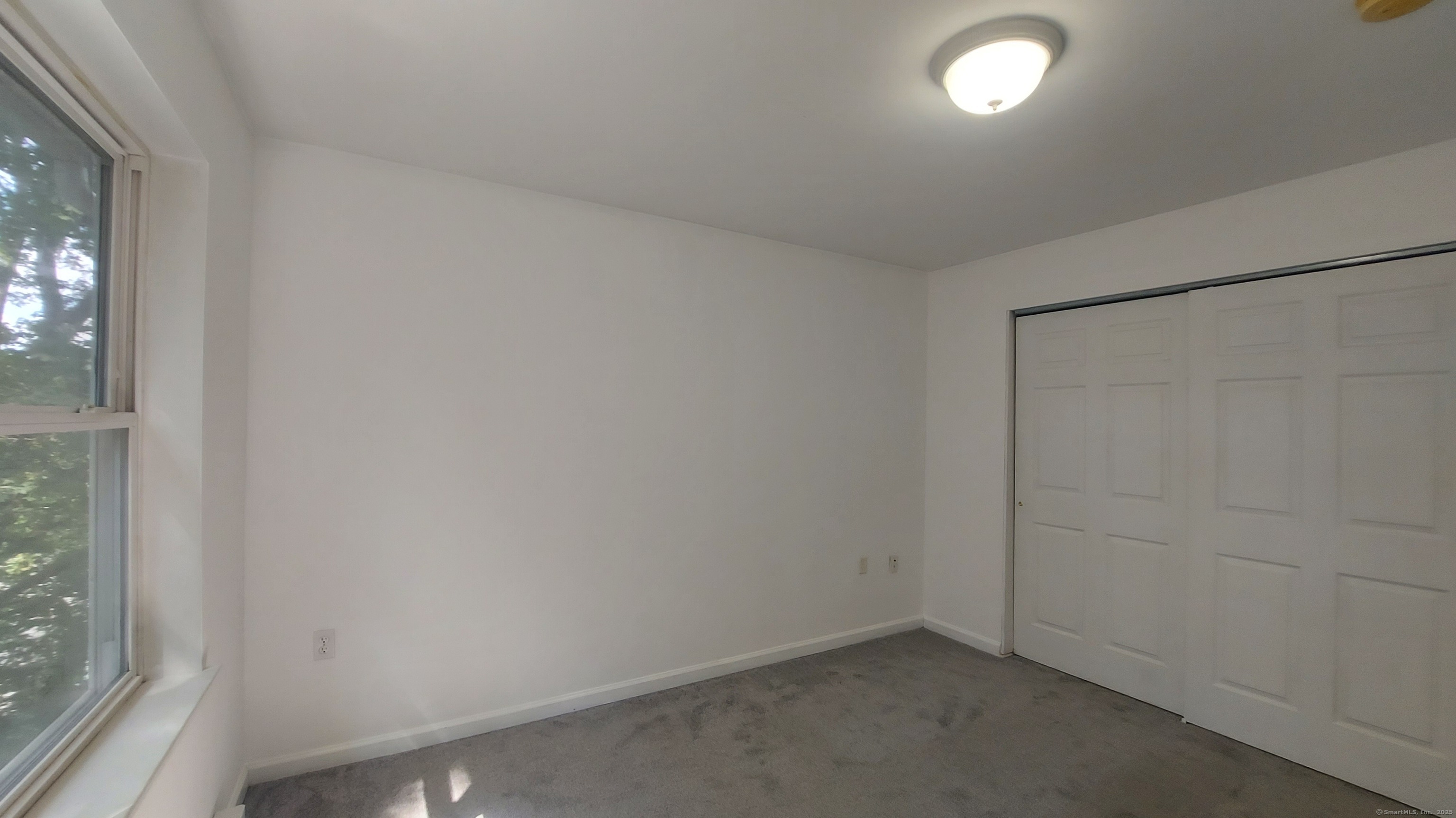 10 Hillcrest Street, Unit B Norwich, CT 06360 - Photo 23 of 34 an empty room with windows