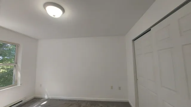 a view of a room with wooden floor and chair