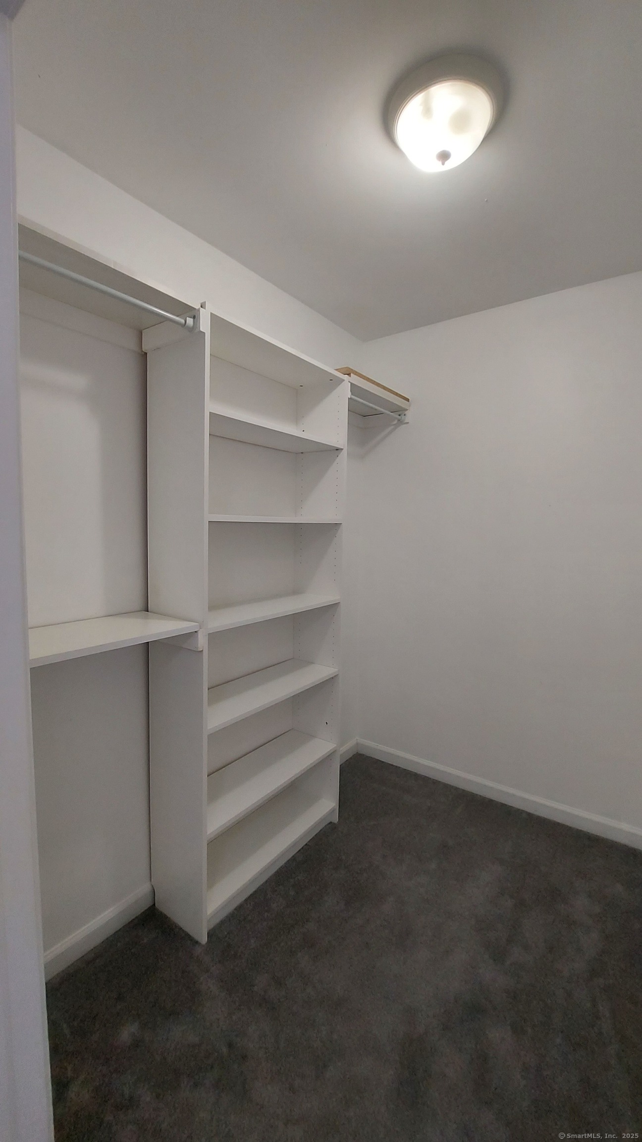 10 Hillcrest Street, Unit B Norwich, CT 06360 - Photo 27 of 34 a view of walk in closet with empty racks