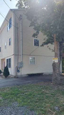 a view of house with yard