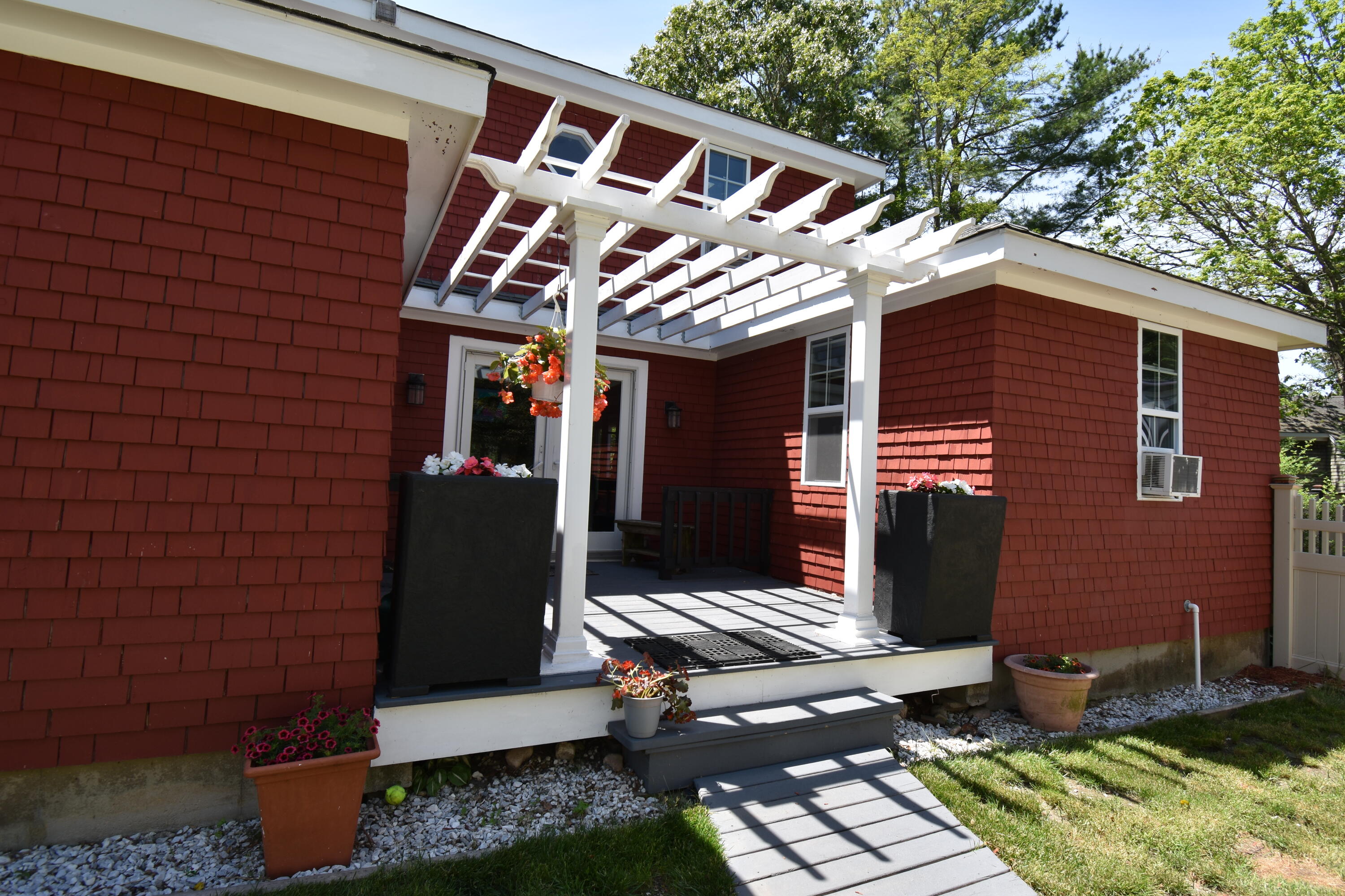 292 Old Mill Road Marstons Mills, MA 02648 - Photo 2 of 39 a front view of a house with garden