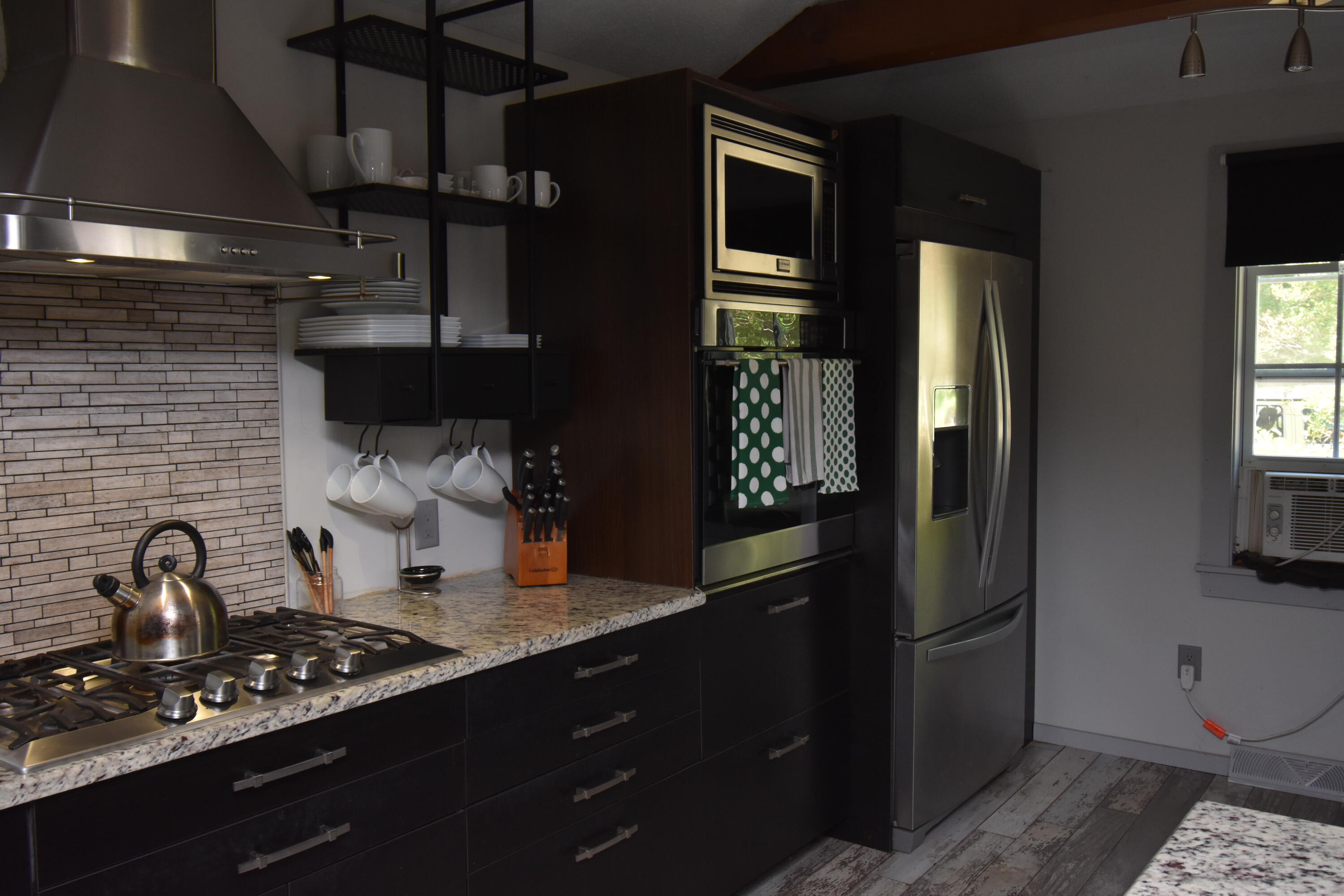 292 Old Mill Road Marstons Mills, MA 02648 - Photo 21 of 39 a kitchen with stainless steel appliances granite countertop a refrigerator and a stove