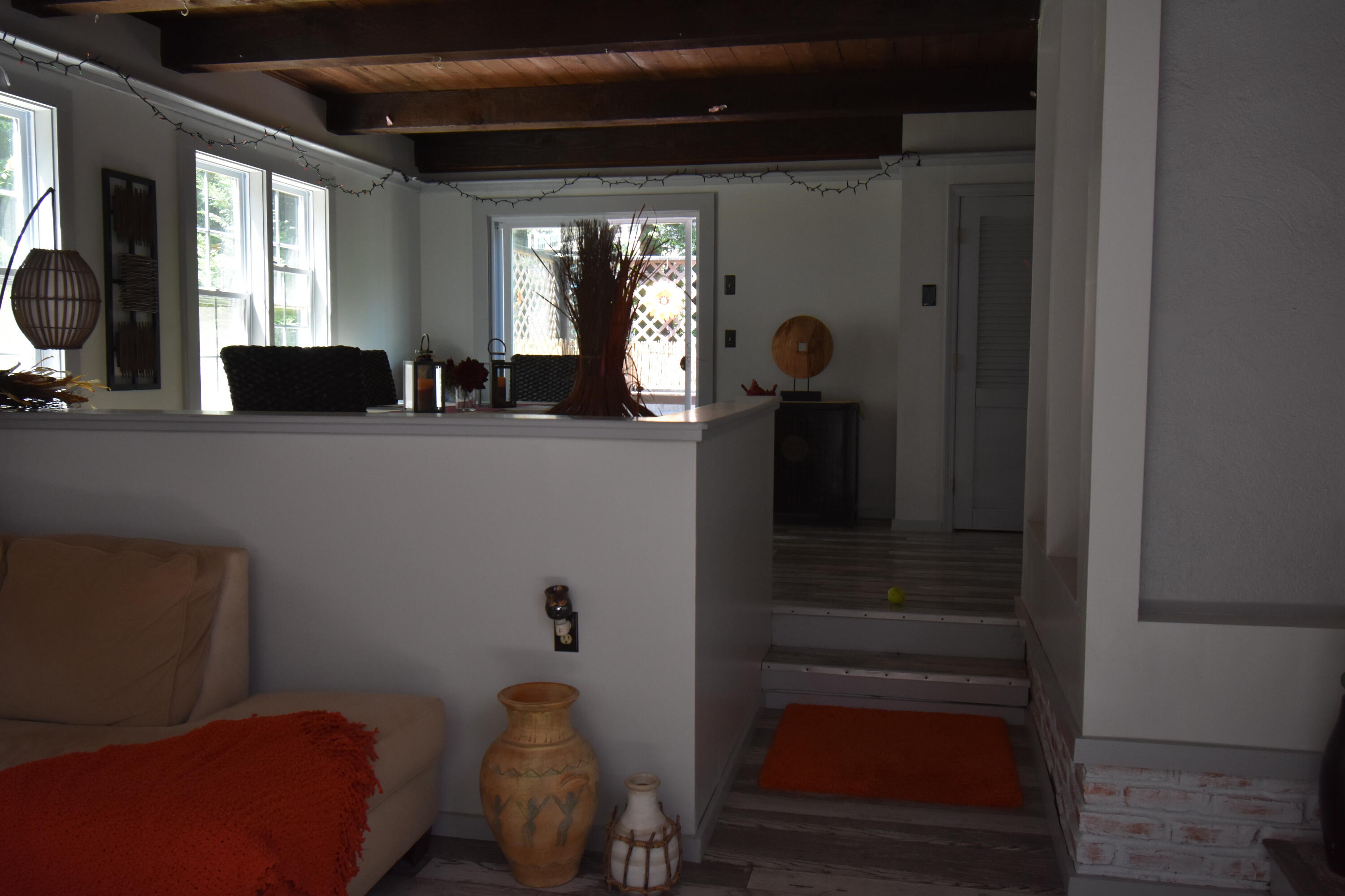 292 Old Mill Road Marstons Mills, MA 02648 - Photo 26 of 39 a living room with furniture and a mirror
