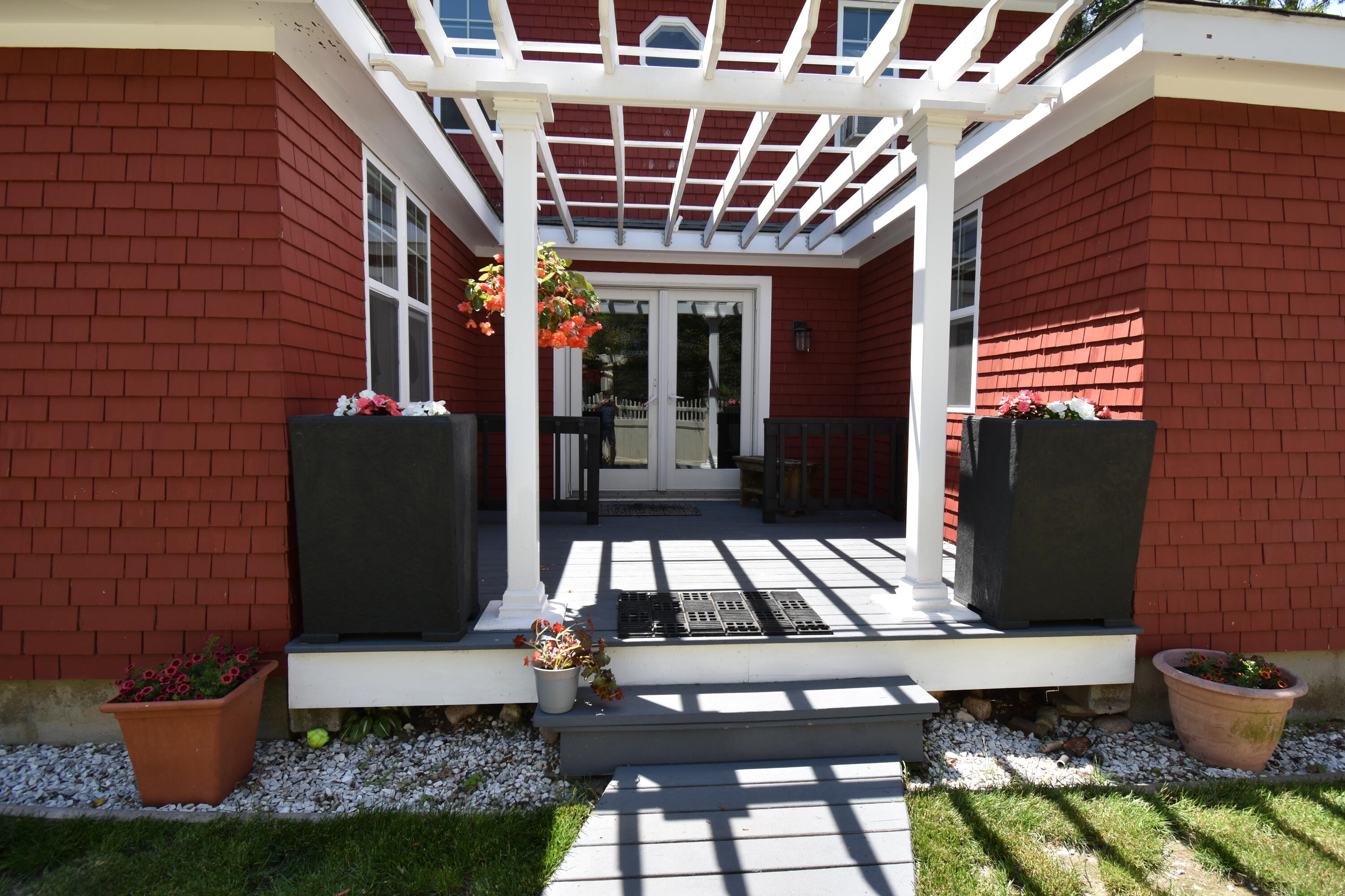 292 Old Mill Road Marstons Mills, MA 02648 - Photo 3 of 39 a front view of a house with outdoor seating