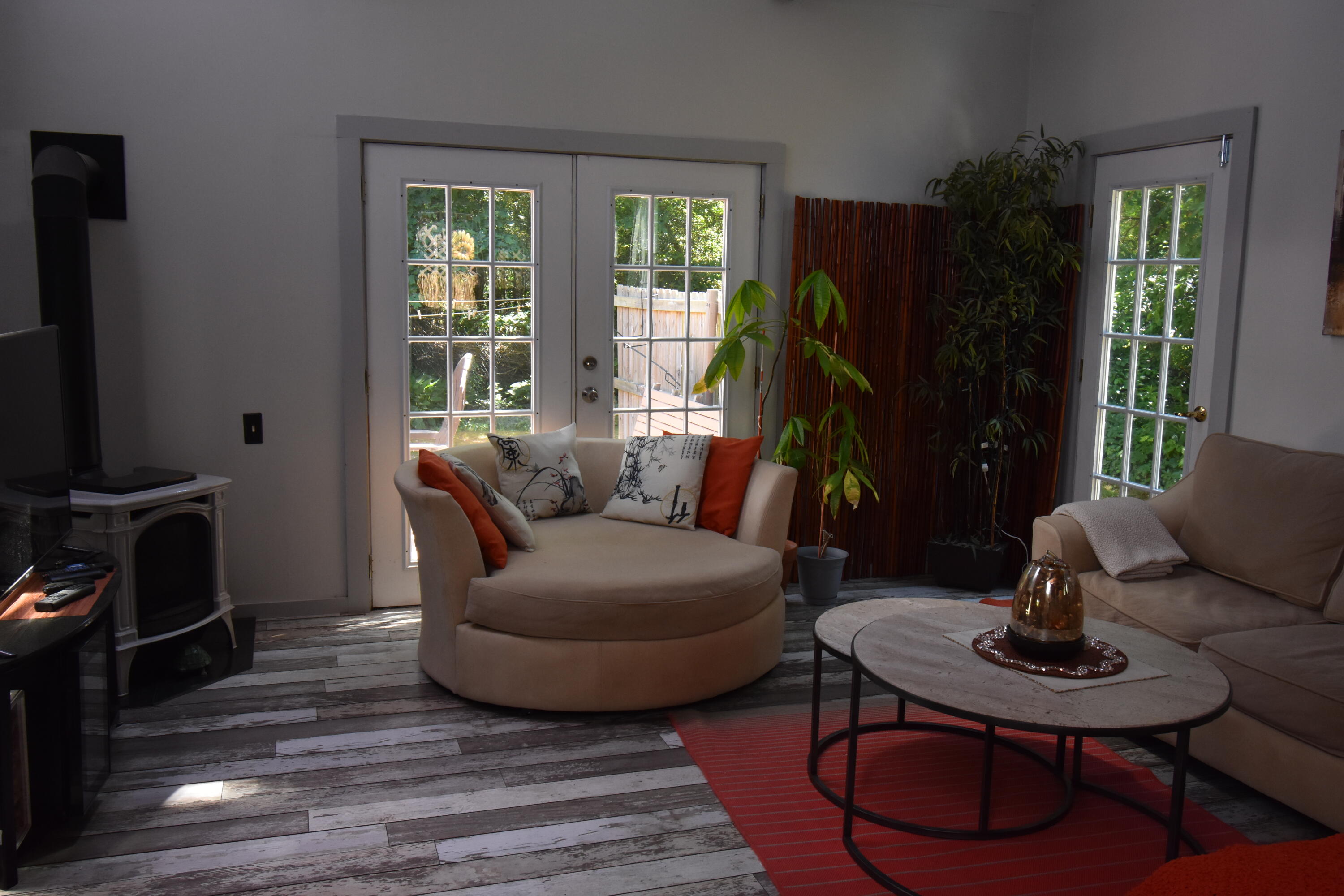 292 Old Mill Road Marstons Mills, MA 02648 - Photo 34 of 39 a living room with furniture a window and a flat screen tv
