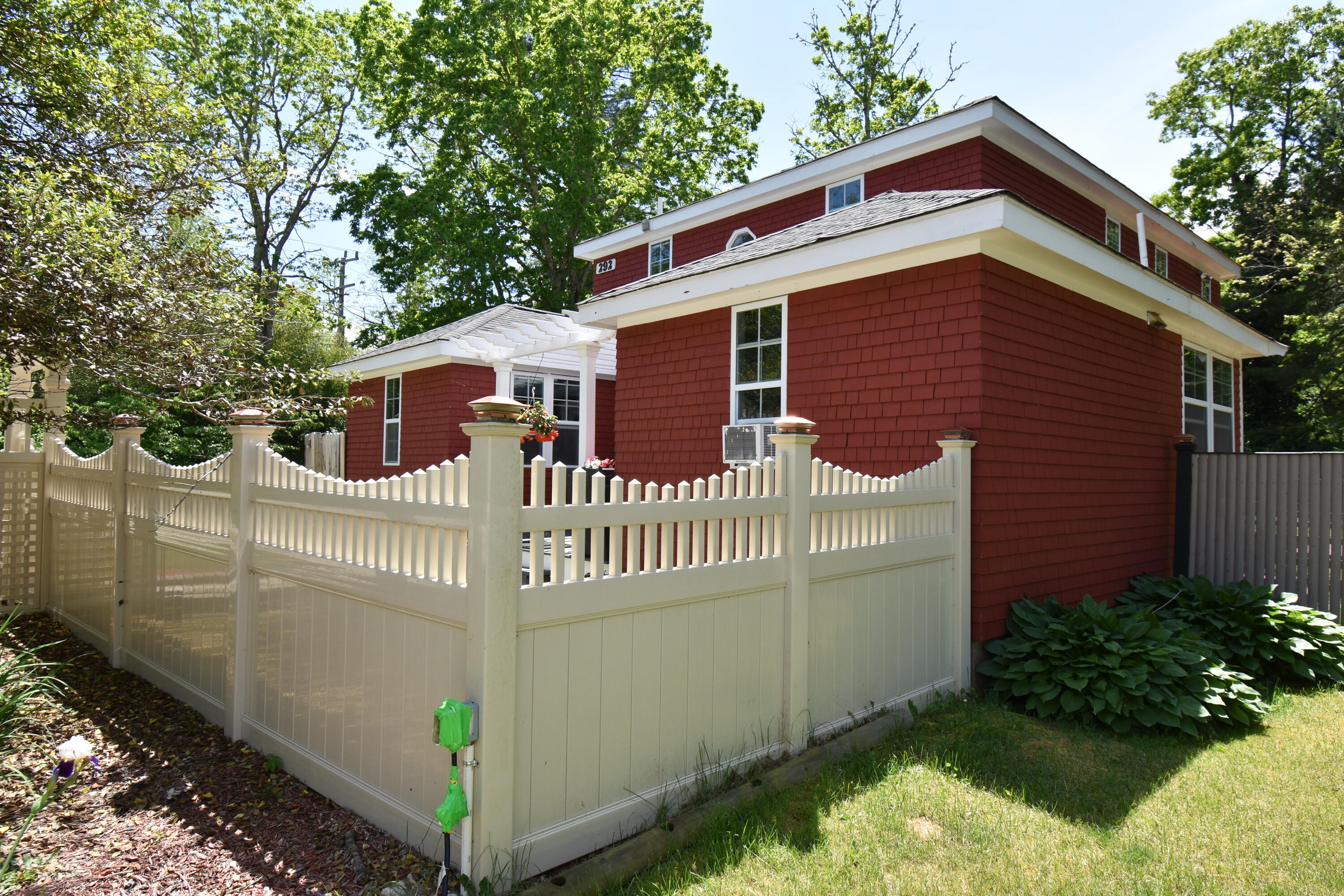292 Old Mill Road Marstons Mills, MA 02648 - Photo 5 of 39 a front view of a house with a garden
