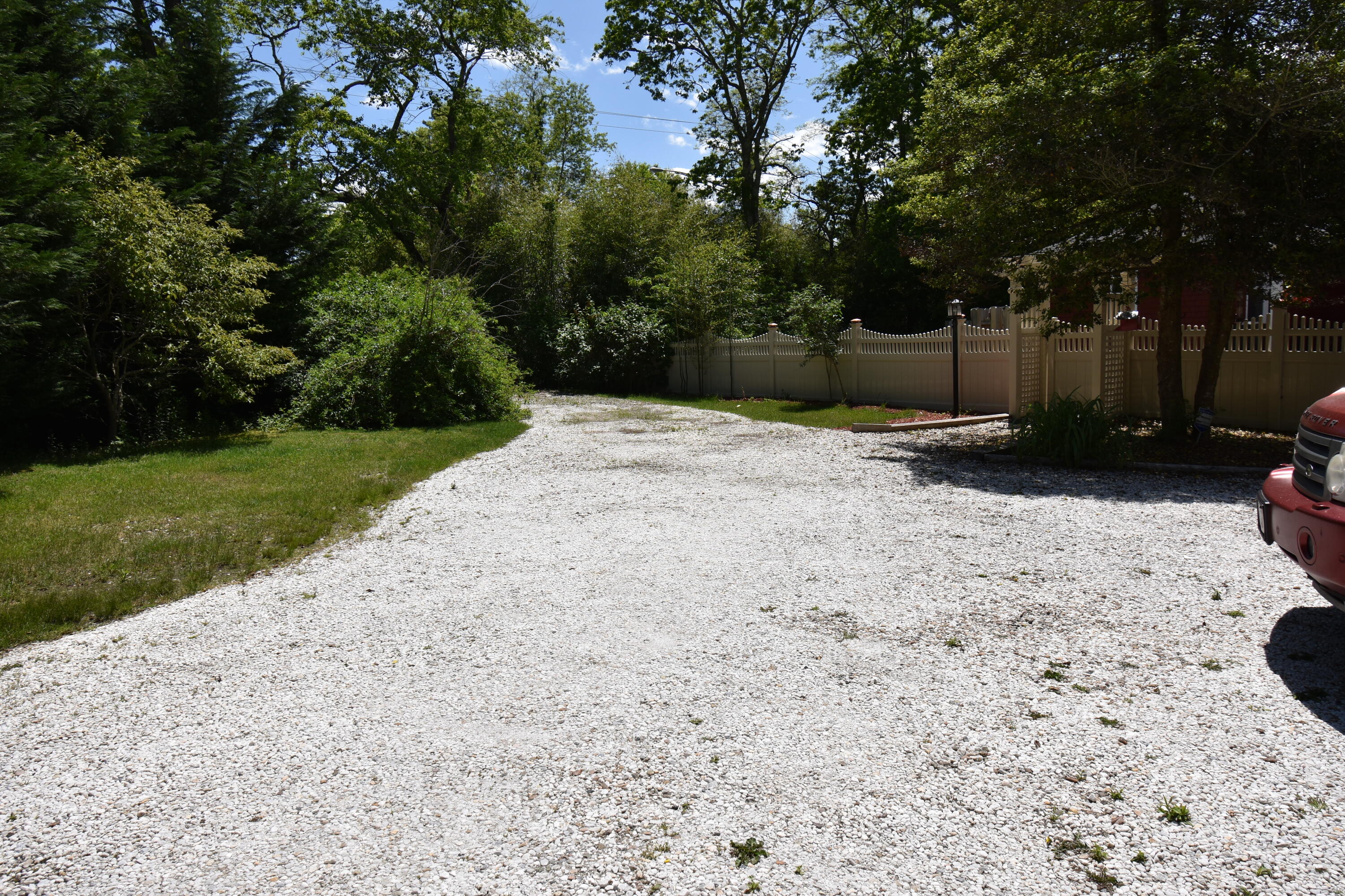 292 Old Mill Road Marstons Mills, MA 02648 - Photo 6 of 39 a backyard of a house with a trees