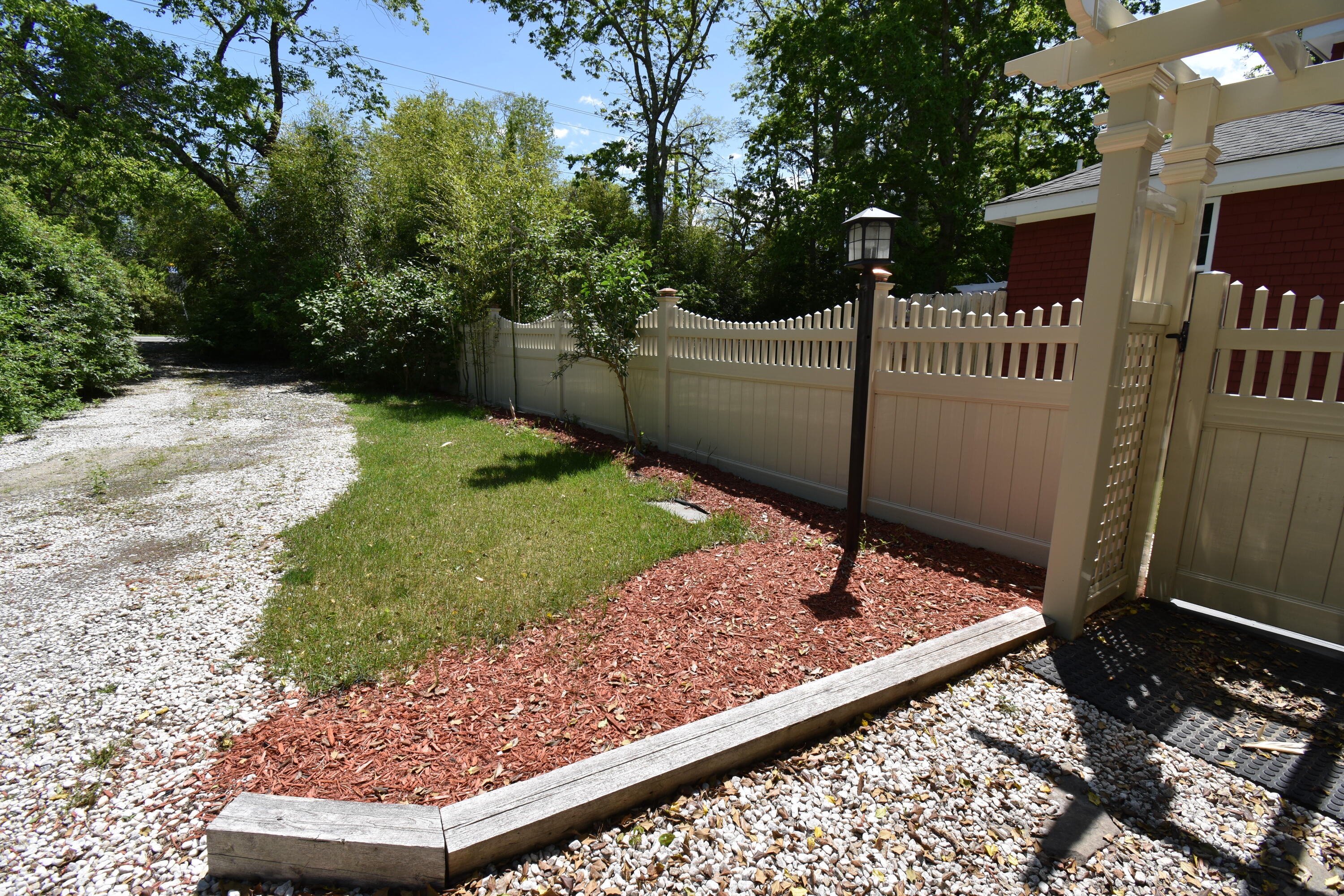 292 Old Mill Road Marstons Mills, MA 02648 - Photo 8 of 39 a view of a backyard with a garden