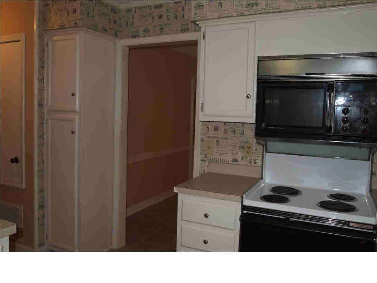 64 Springridge Circle Jackson, MS 39211 - Photo 11 of 25 Electric stove and pantry