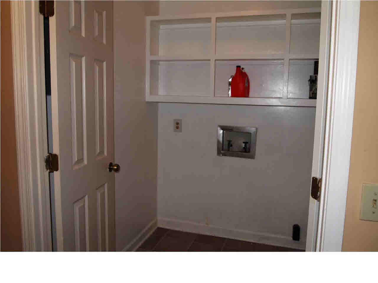 64 Springridge Circle Jackson, MS 39211 - Photo 12 of 25 Laundry room with shelving